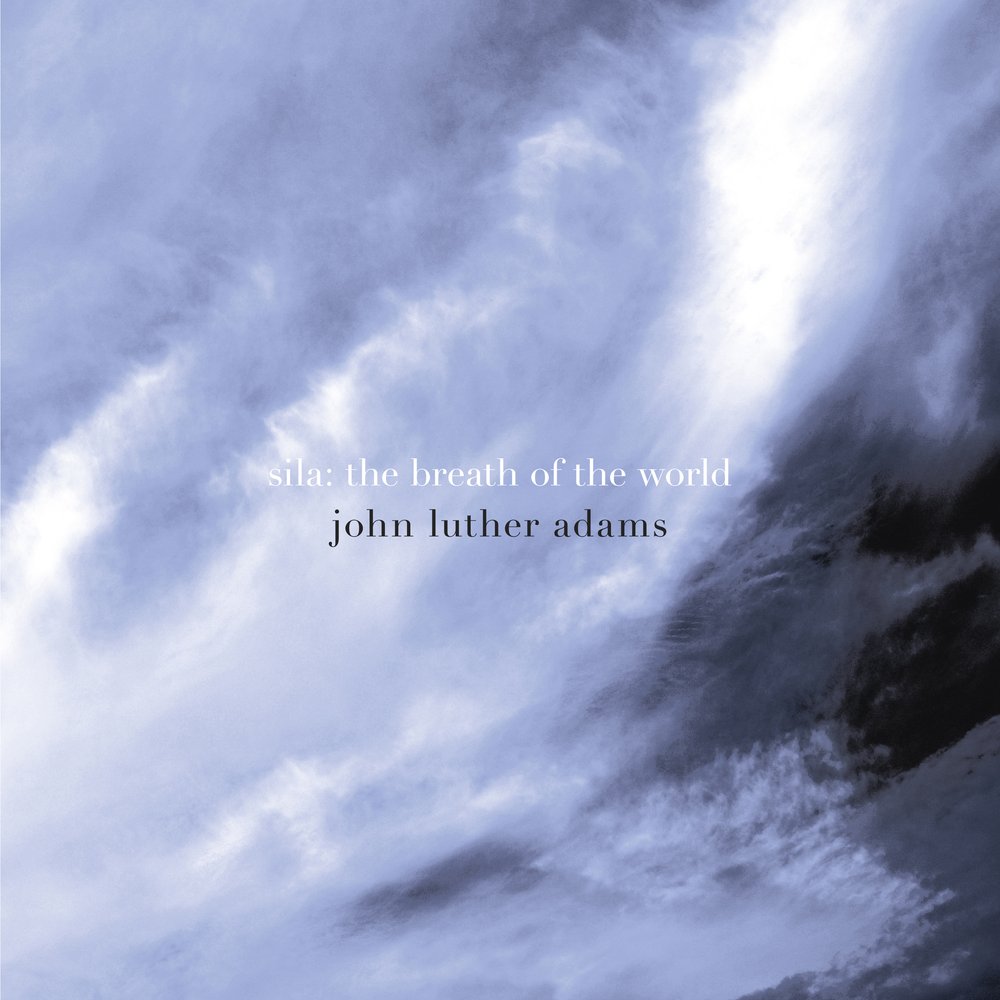 A photograph of clouds with the words "sila: the breath of the world, john luther adams."